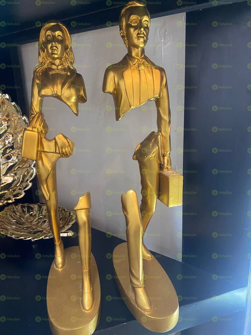 Golden Walking Male And female Statue