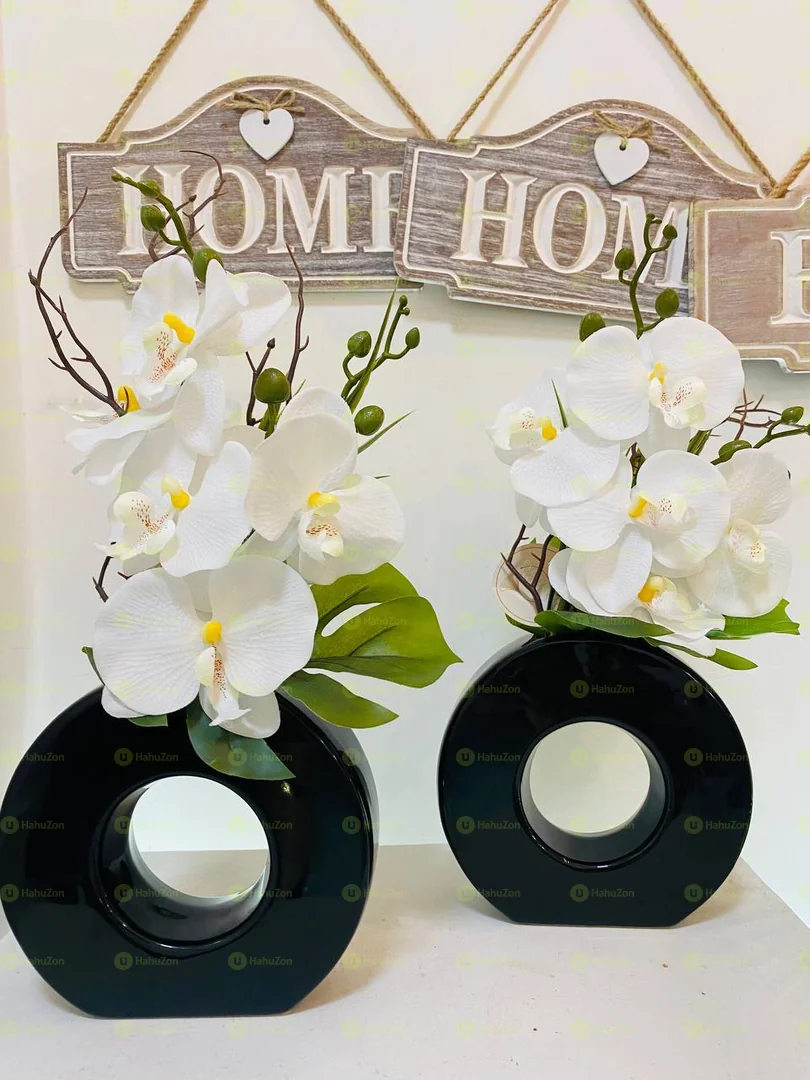 Black Ceramic Vase And Orchid Flowers