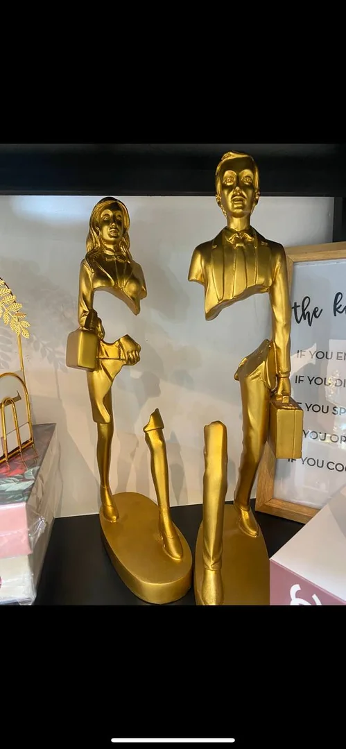 Golden Walking Male And female Statue